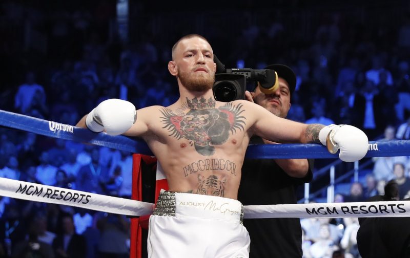 Followers go wild as Conor McGregor pulls on Celtic kit at Dublin gym